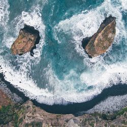 High angle view of rock in sea