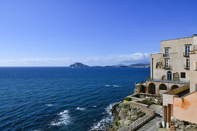 Scenic view of sea against clear blue sky