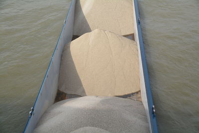 High angle view of sand in boat