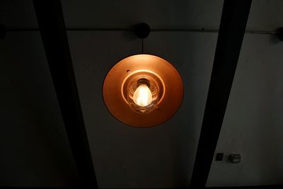 Low angle view of illuminated electric lamp