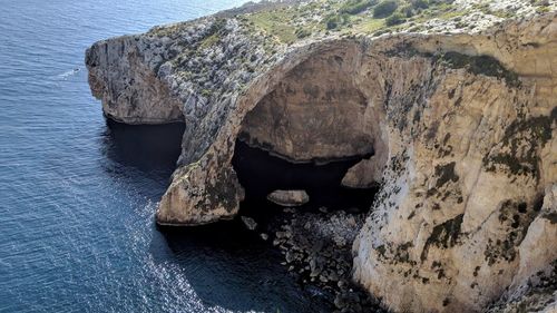 Scenic view of rock formation in sea