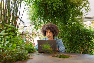 Portrait of woman using laptop at home