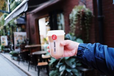 Midsection of person holding text