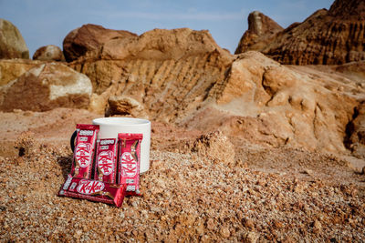 Close-up of text on rock in desert