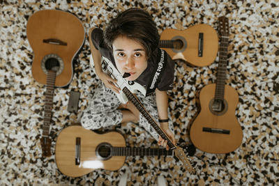 Portrait of a boy playing guitar