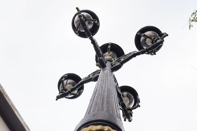 Low angle view of street light against sky