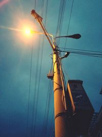 Low angle view of electricity pylon against sky