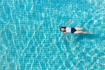 High angle view of woman swimming in pool