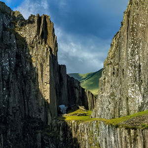 Panoramic view of rocks and mountains against sky