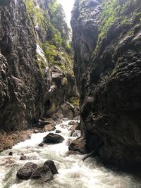 Stream flowing through rocks in forest