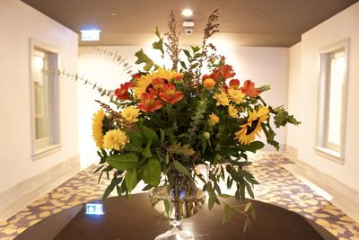 Flower vase on table at home