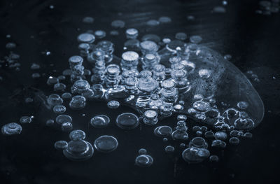 Texture pattern background white winter, river ice air bubbles stagnant. drawing on ice frost formed