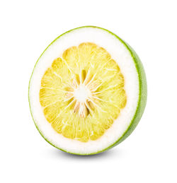 Close-up of lemon slice against white background