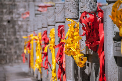 Multi colored umbrellas hanging outside temple