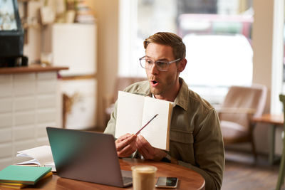 Man using laptop at office