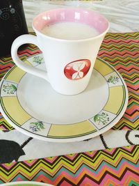 High angle view of coffee cup on table