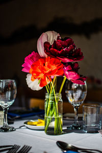 Close-up of roses in glass vase on table