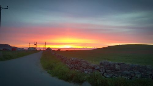 Scenic view of landscape against sky during sunset