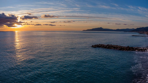 Scenic view of sea against sky during sunset