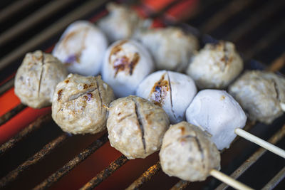 High angle view of meat on barbecue grill