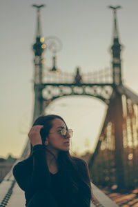 Portrait of young woman on the bridge