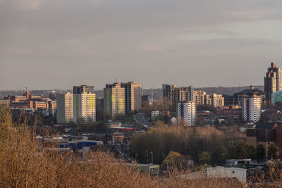 High angle view of buildings in city against sky