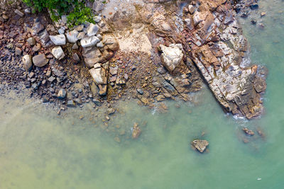 High angle view of rock formation in lake