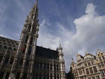 Low angle view of buildings in city against sky