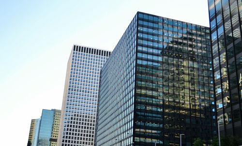 Low angle view of skyscrapers against sky