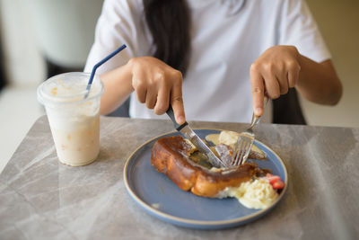Midsection of man having breakfast