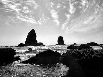 Scenic view of sea against cloudy sky