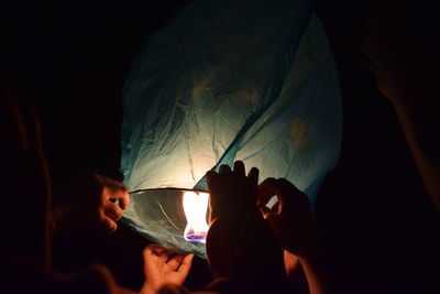 Group of people in the dark