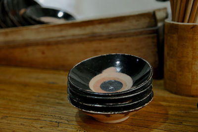 High angle view of old tea cup on table