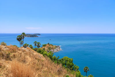 Scenic view of sea against clear blue sky