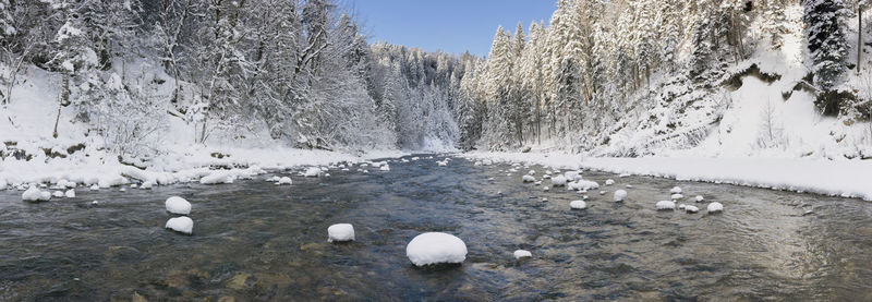 River in canyon with ice and snow at cold winterday