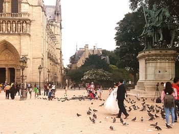 People walking in front of building