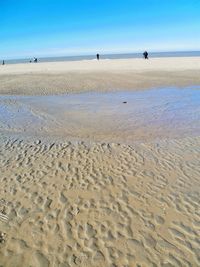 Scenic view of beach against clear sky