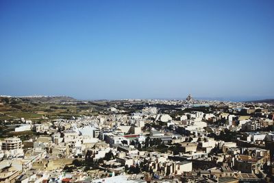 High angle shot of townscape against clear blue sky