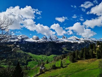 Scenic view of snowcapped mountains against sky