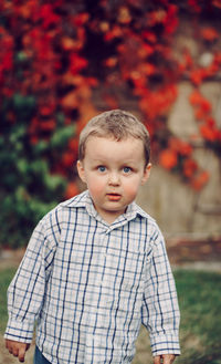 Portrait of cute boy standing outdoors