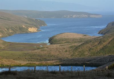 Scenic view of lake and mountains against sky