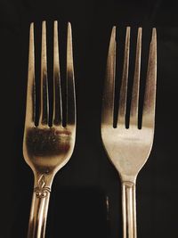 Close-up of wineglass against black background