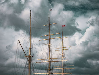 Low angle view of sailboat in sea against sky