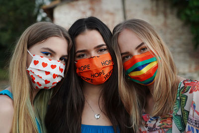 Portrait of young women wearing masks