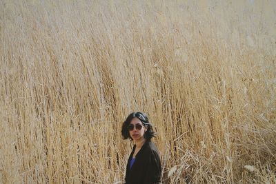 Portrait of young woman standing outdoors