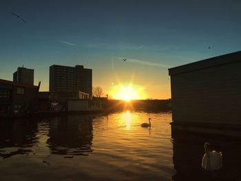 Scenic view of sunset over city