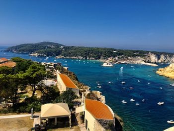 High angle view of bay against blue sky