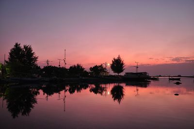 Scenic view of lake at sunset