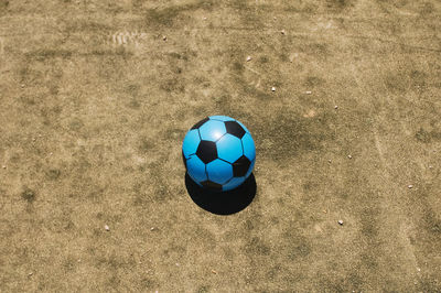 High angle view of blue soccer ball on field