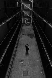 High angle view of man walking on staircase